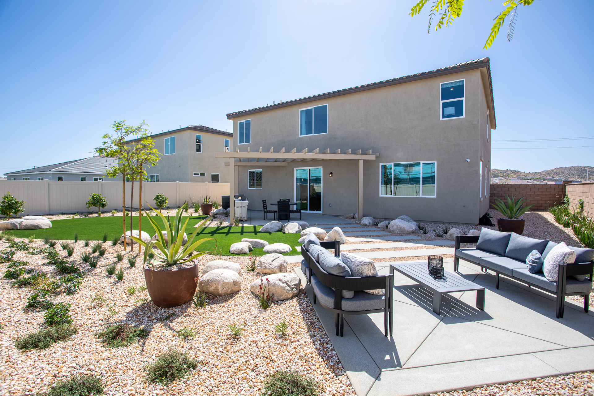 backyard with seating area and desert landscaping