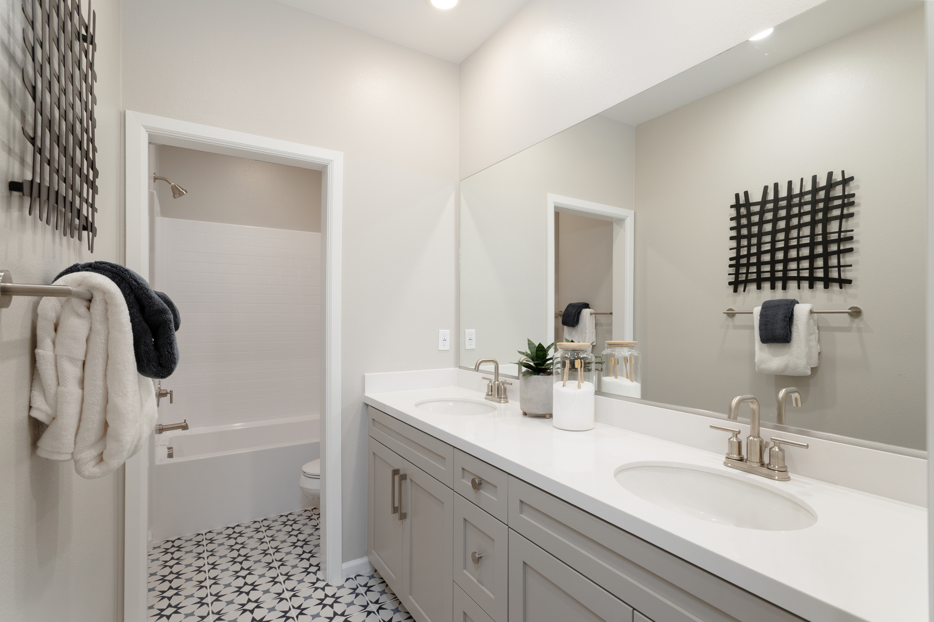 bathroom with tile floors and white countertops