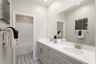 bathroom with tile floors and white countertops