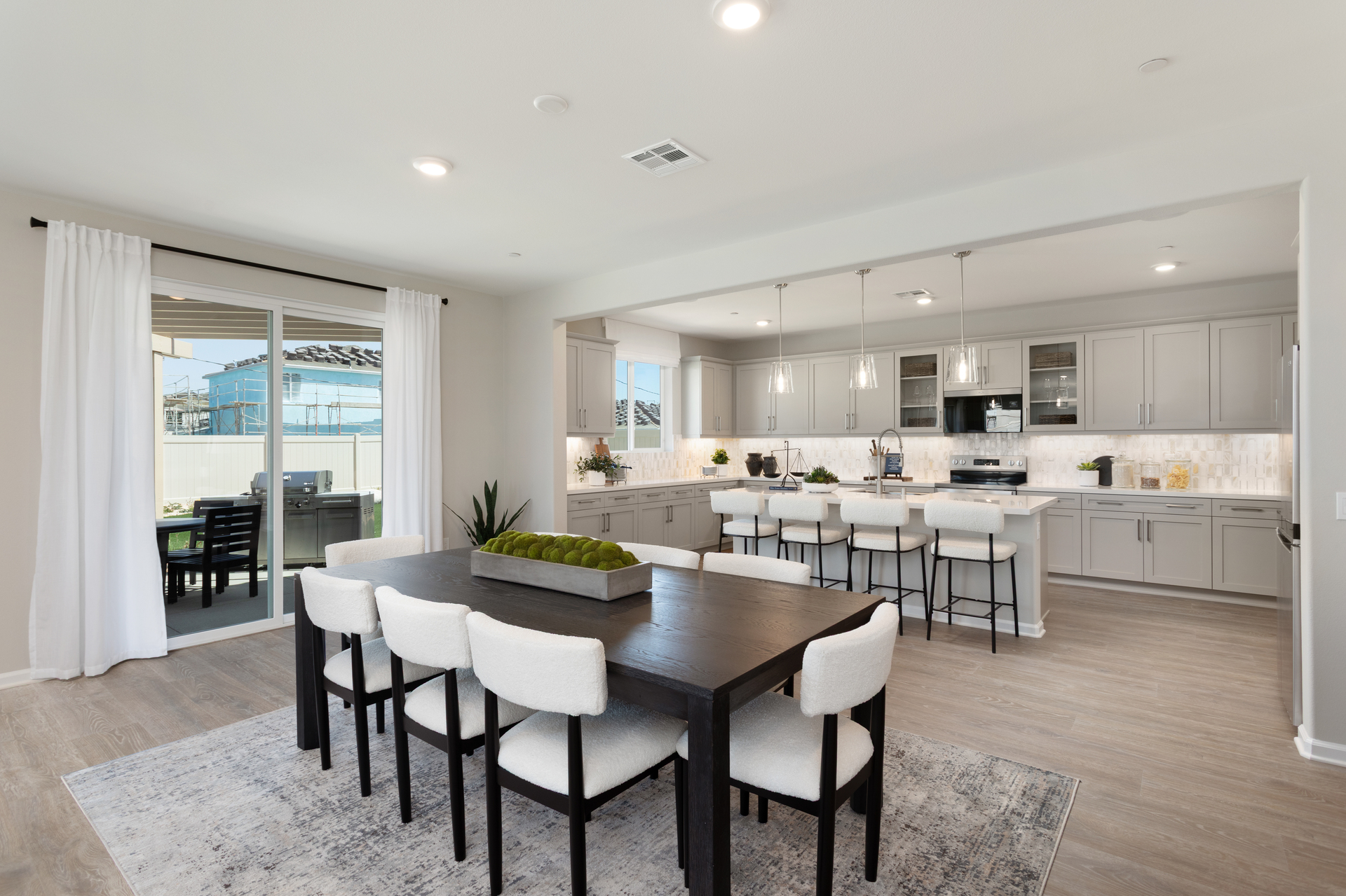dining area with neutral floors and large windows