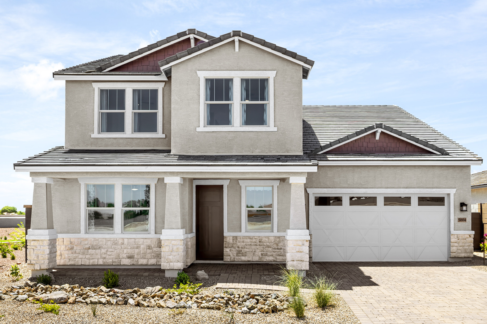 two-story home with desert landscaping
