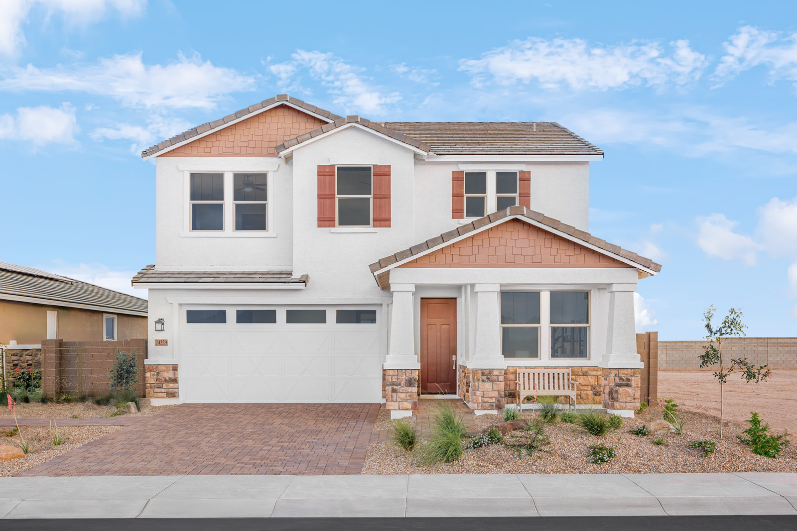 two-story home with desert landscaping