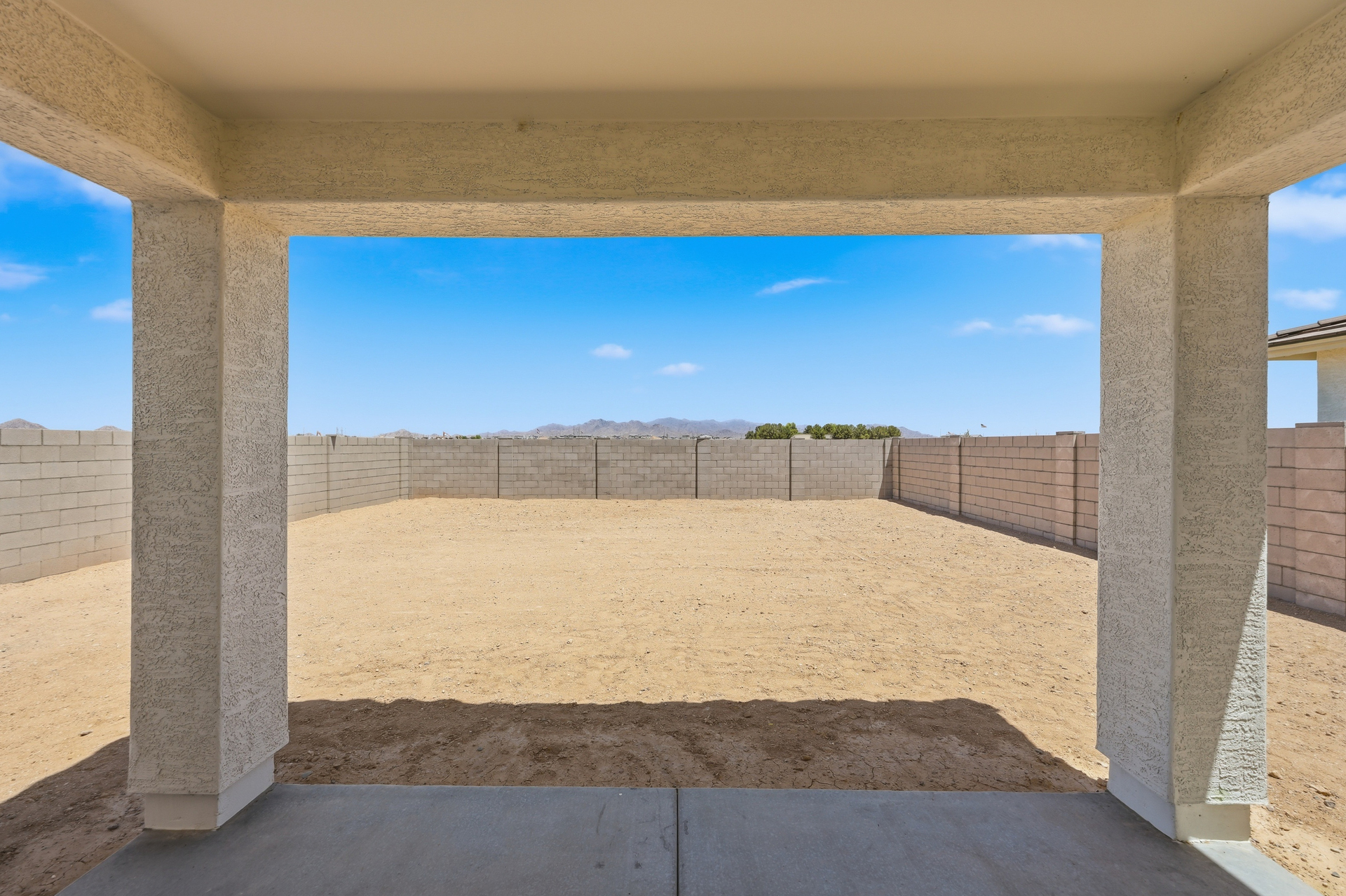spacious dirt backyard ready for endless entertaining