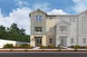 exterior of three-story townhome with neutral paint and covered front porch