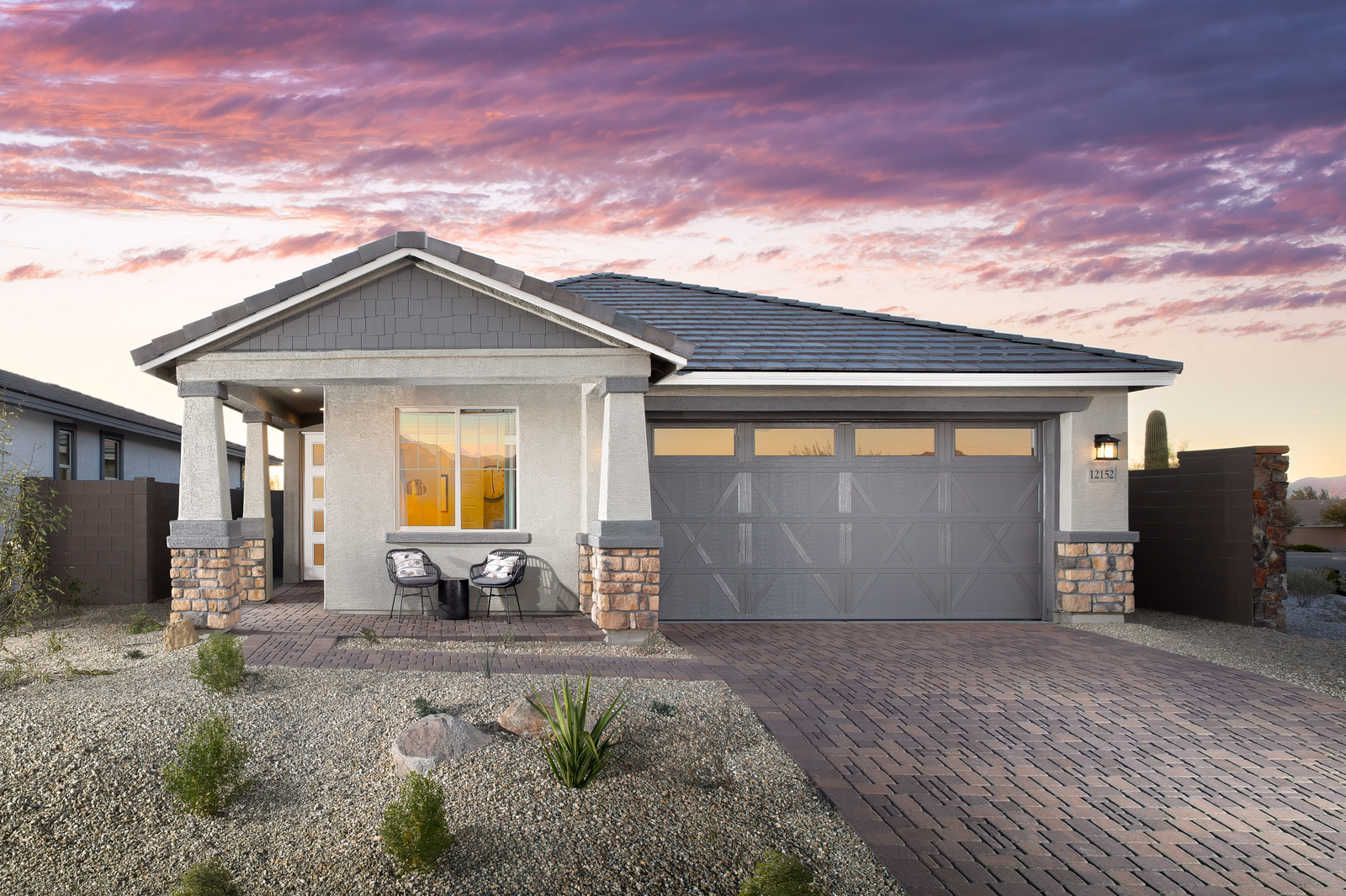 single-story home with desert landscaping 