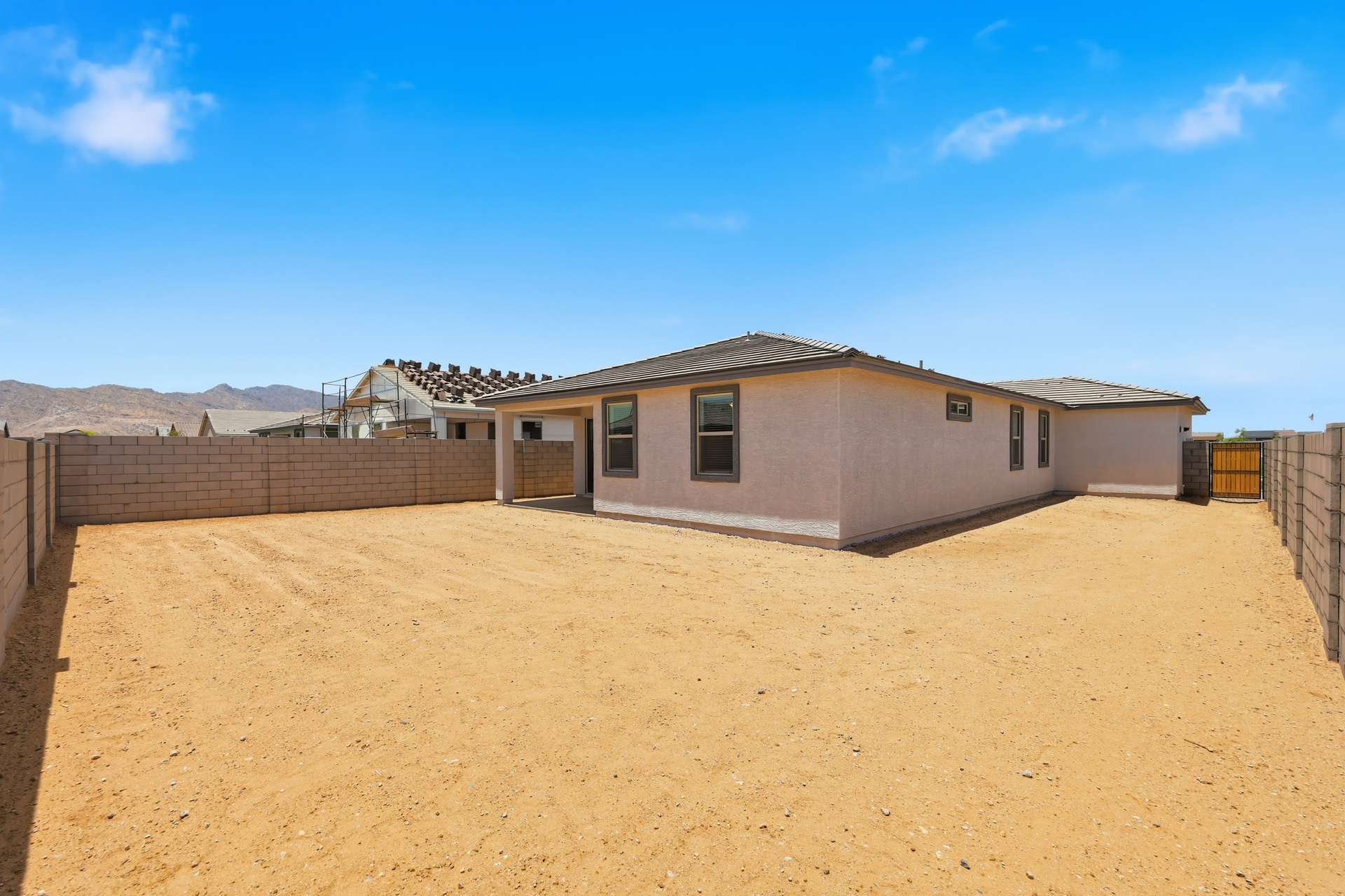 spacious dirt backyard ready to become a desert oasis 