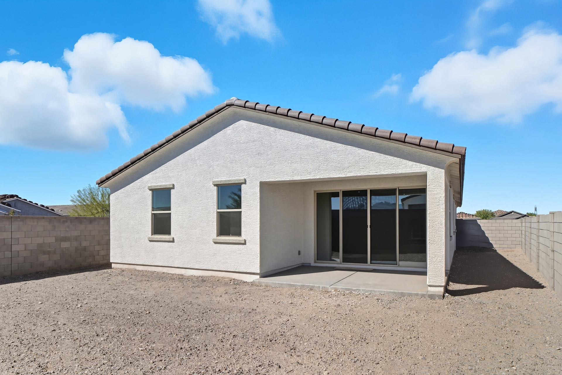 spacious covered patio with outdoor wall outlet