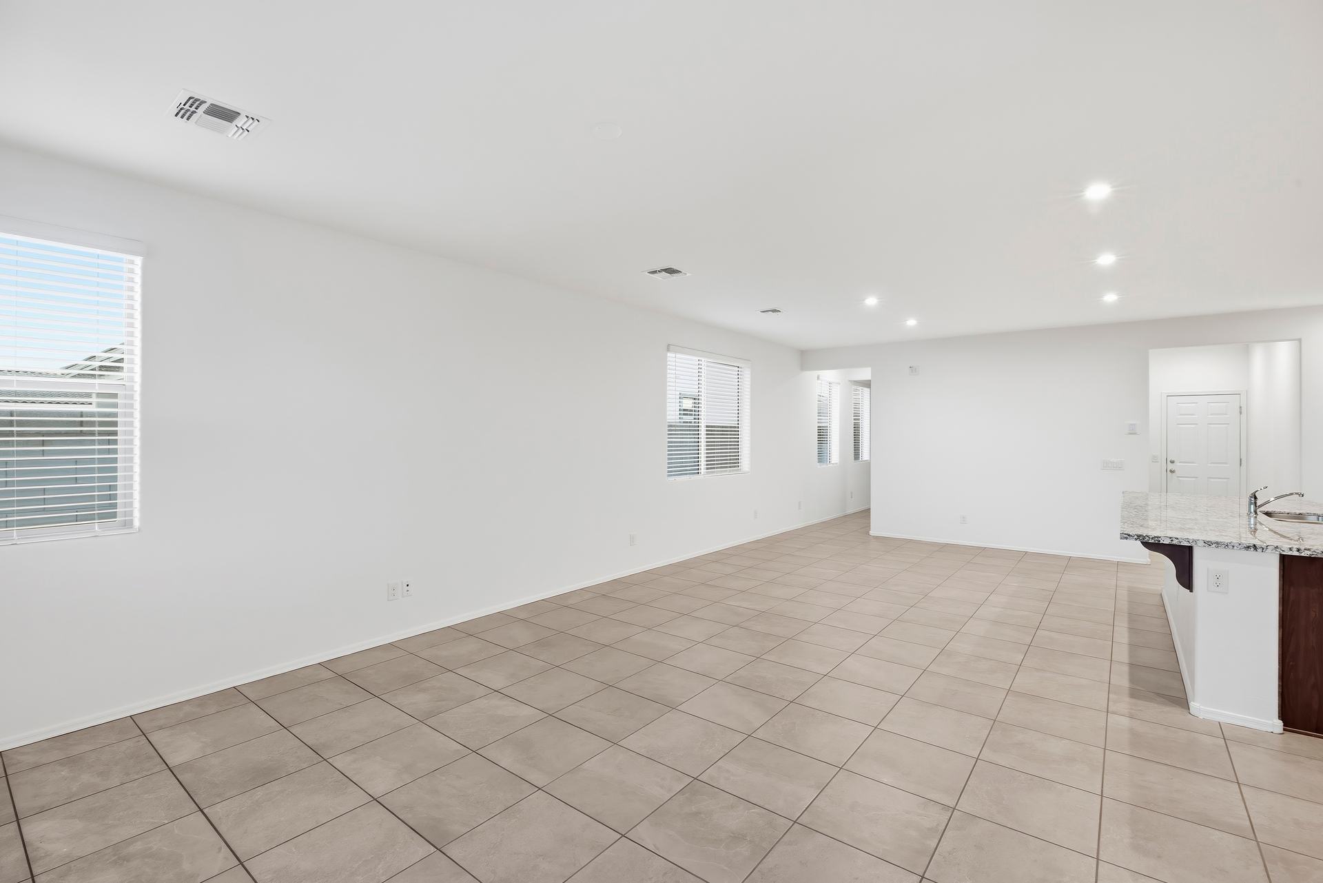 open-concept space with tile flooring and recessed lights