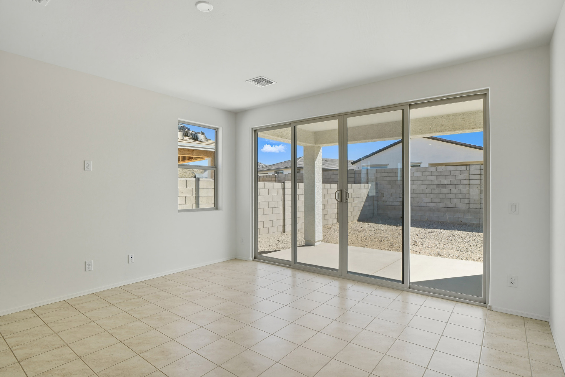 open-concept space with wood-like flooring, recessed lights, and upgraded 12ft sliding glass door