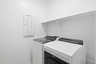 laundry room with whirlpool washer and dryer