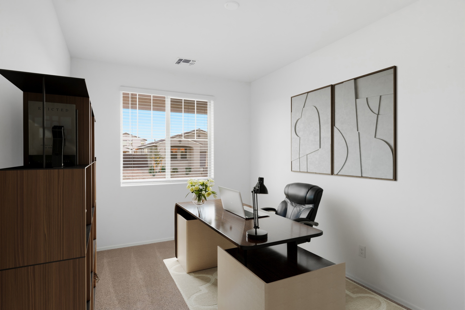 at home office with wooden desk and leather office chair