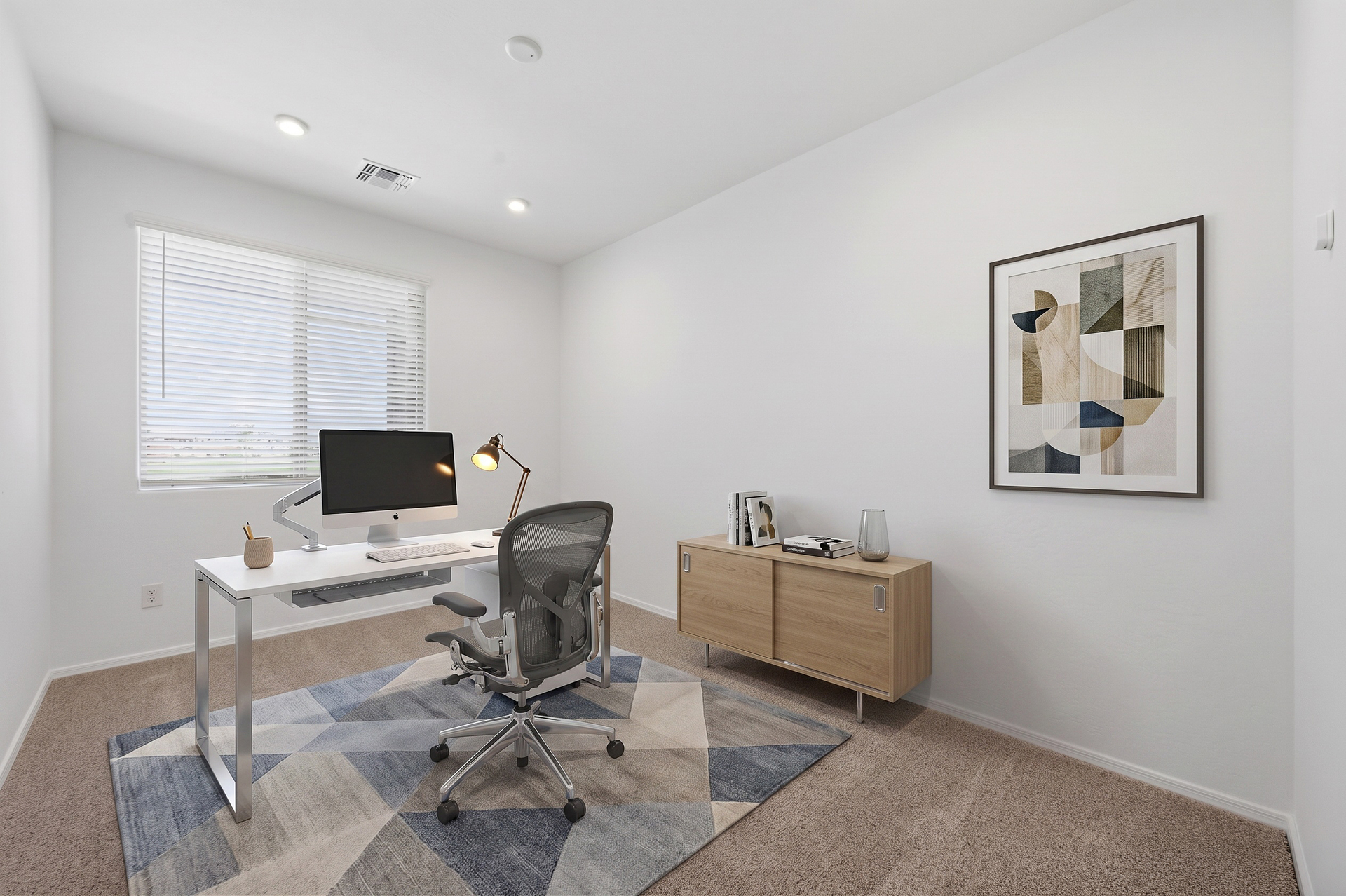 at home office with white desk, oak drawer, and herman miller aeron chair