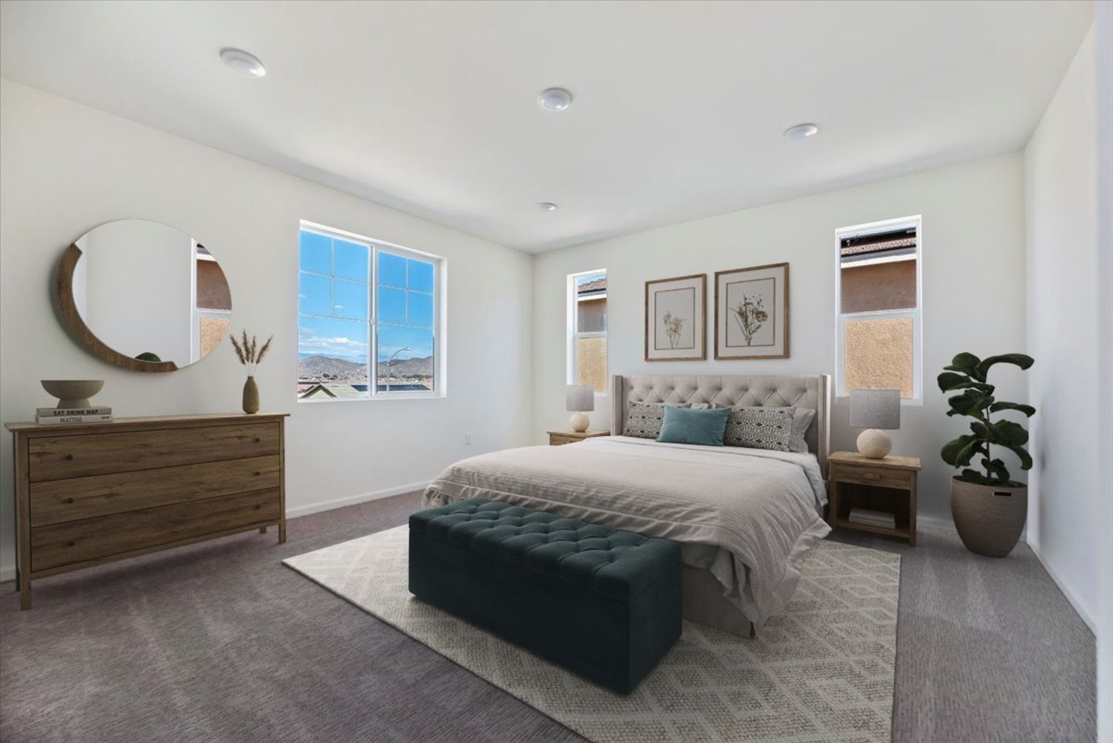 primary bedroom with a large bed, two nightstands, and a brown dresser with a mirror above it