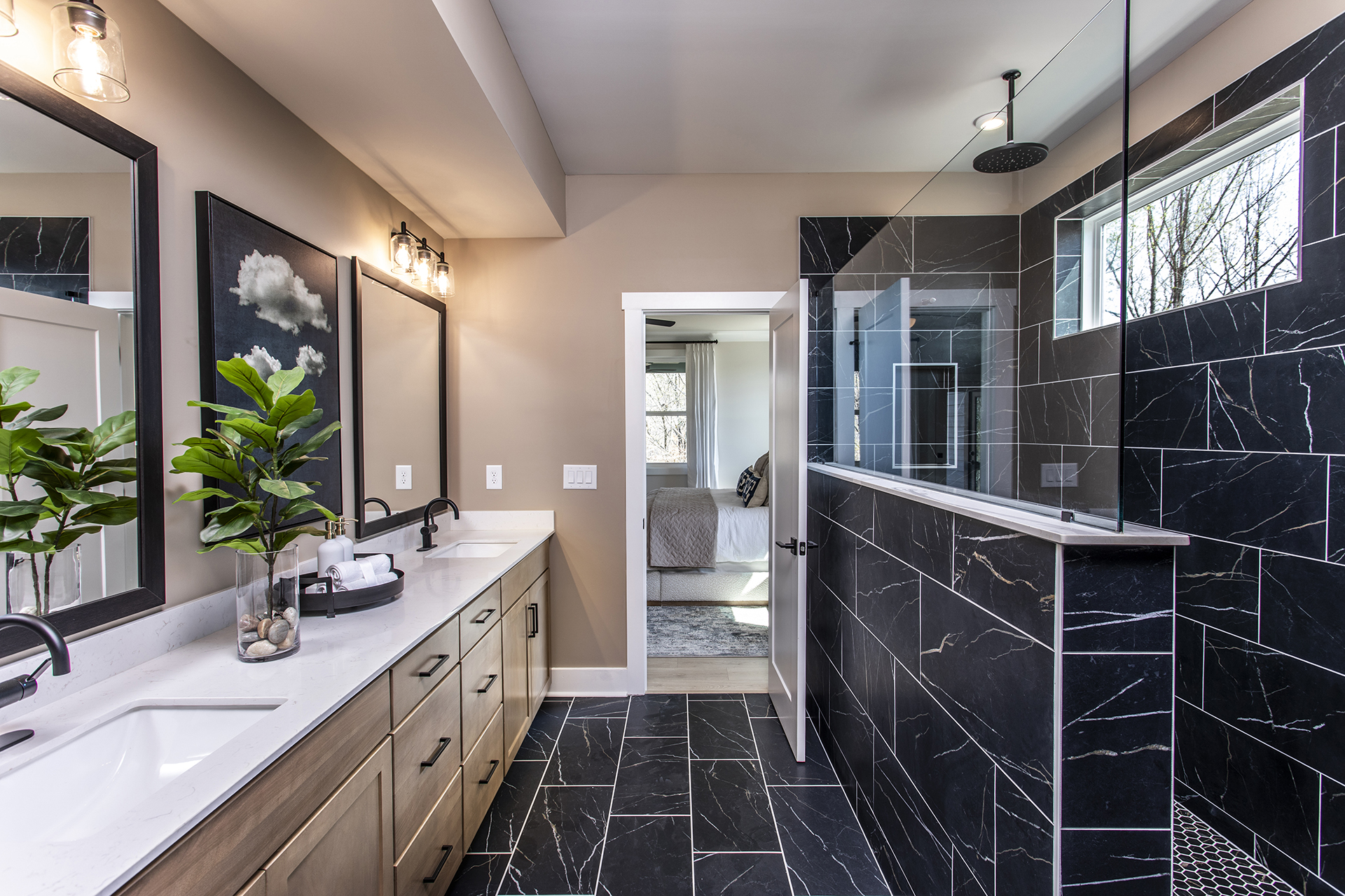 primary bathroom with wood-finish cabinets and tile flooring