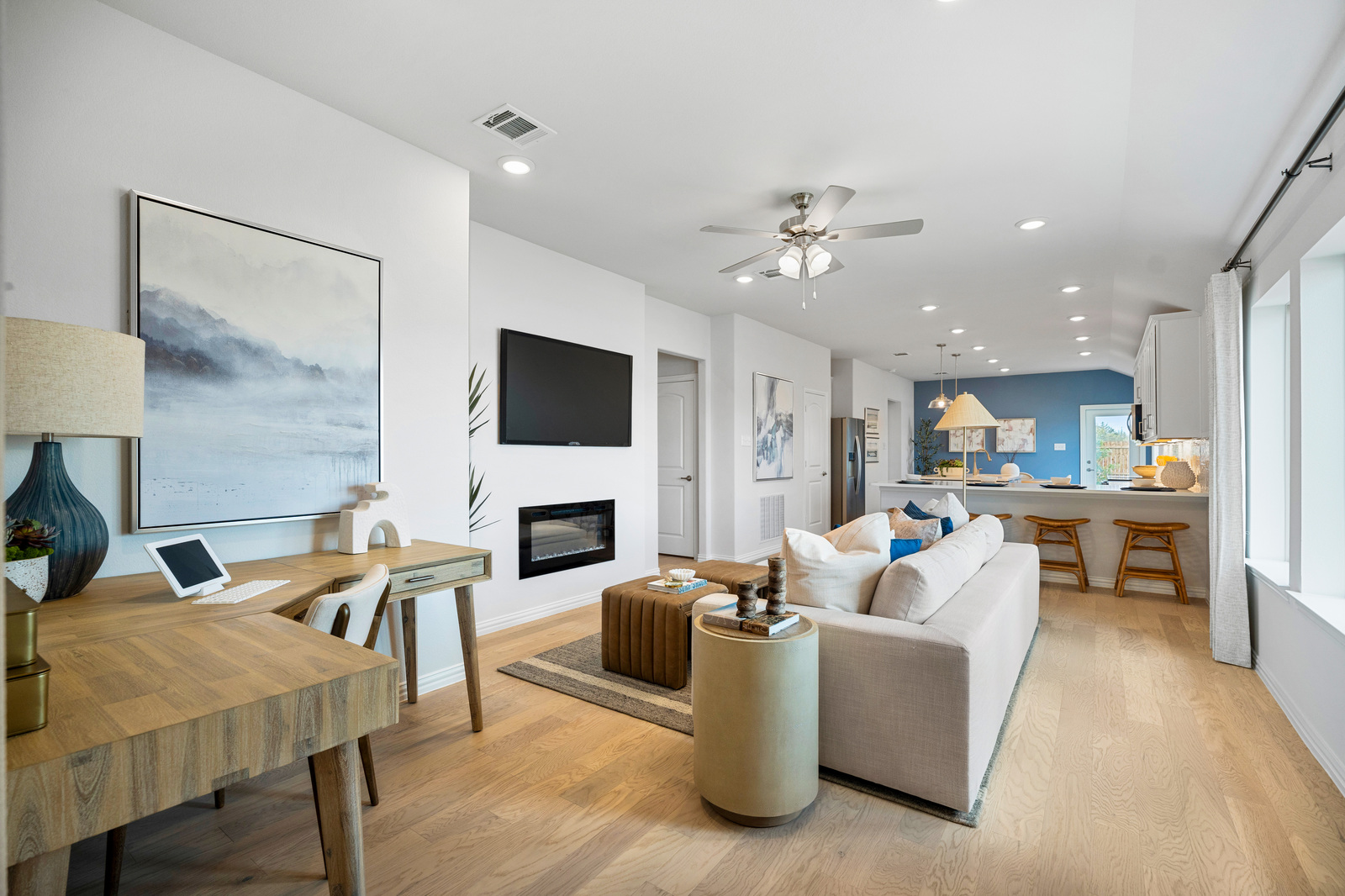 great room with fireplace and hardwood floors