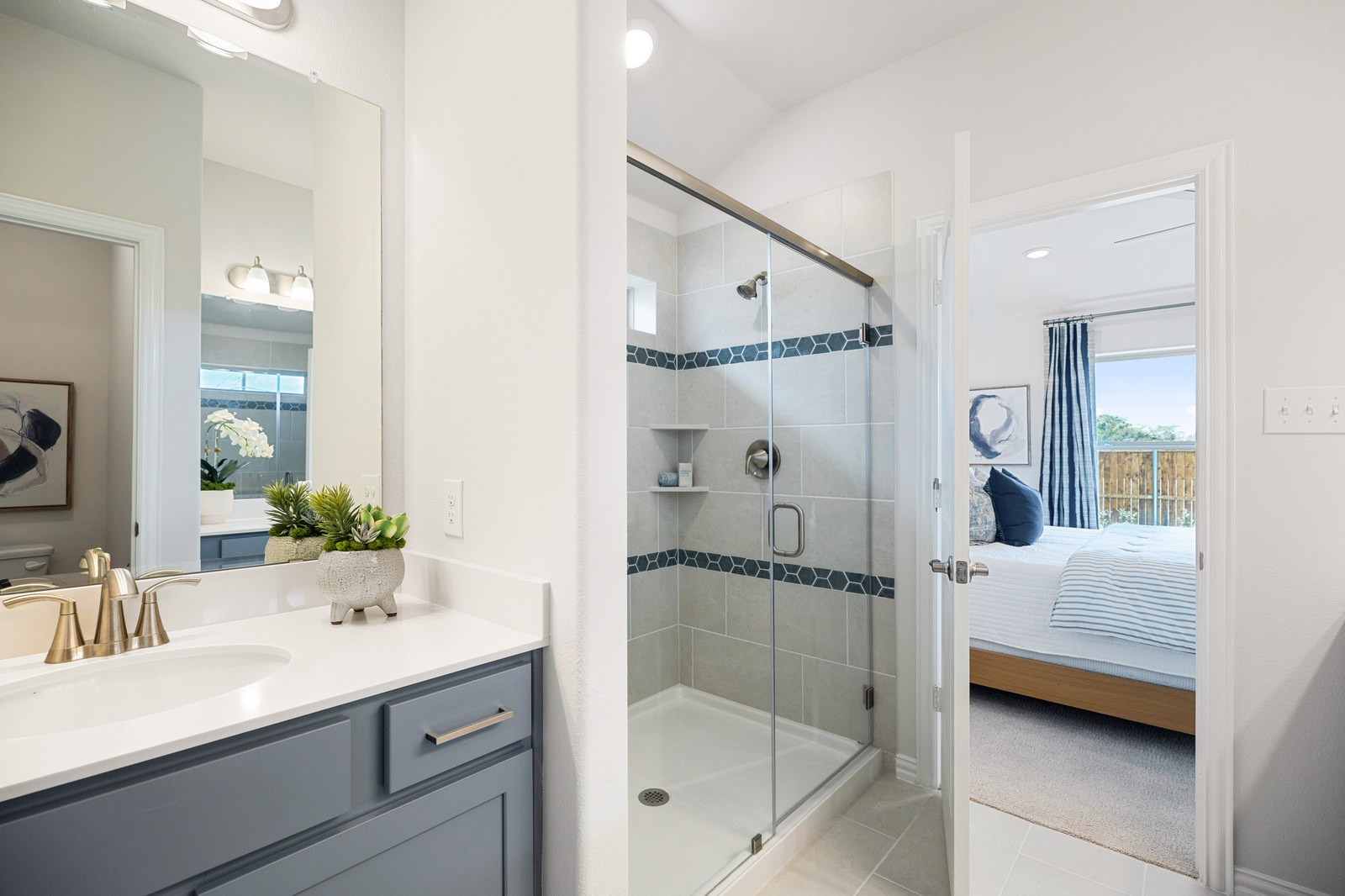 primary bathroom with tile floors and shower