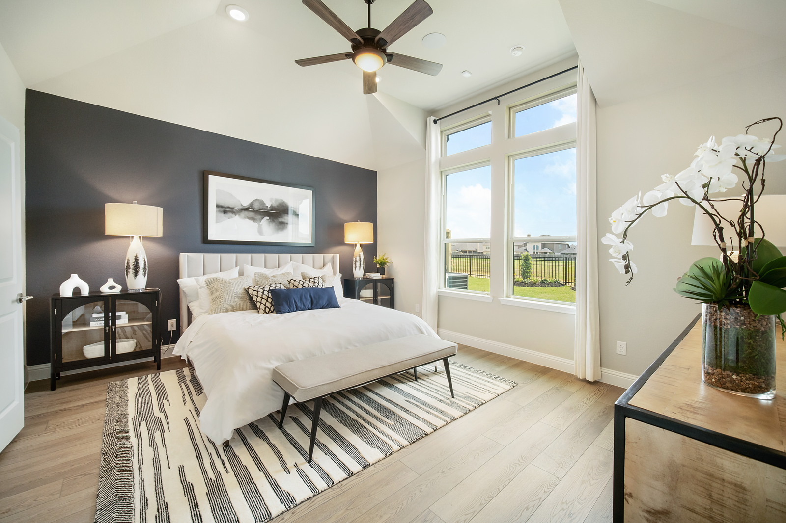 bedroom with black accent wall and night stands