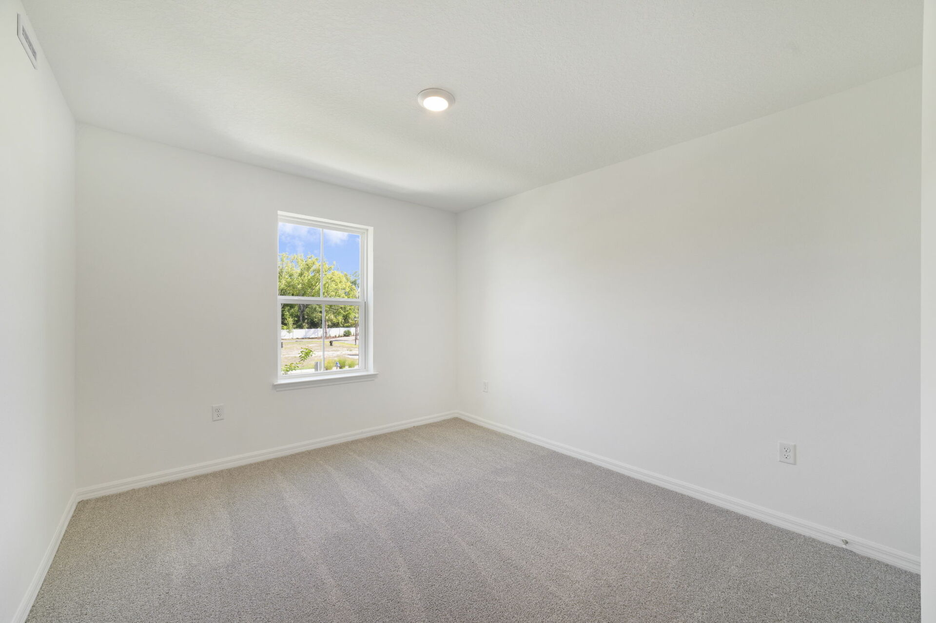 carpet throughout with a closet and a single window