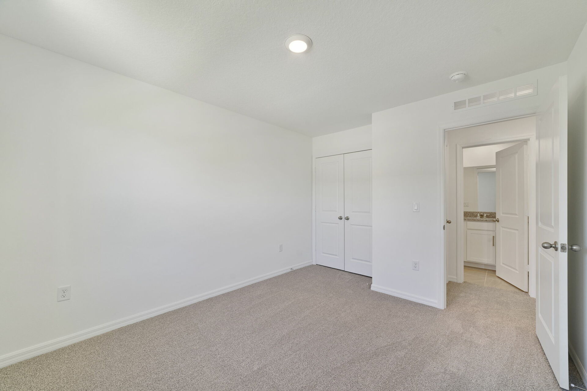 carpet throughout with a closet and a single window