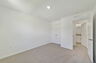 carpet throughout with a closet and a single window