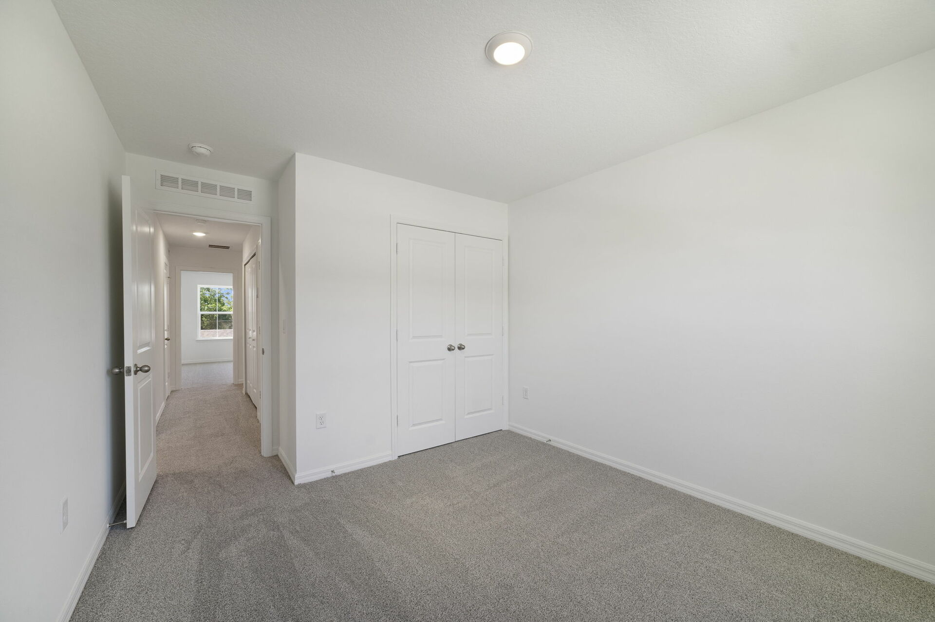 carpet throughout with a closet and a single window