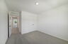 carpet throughout with a closet and a single window
