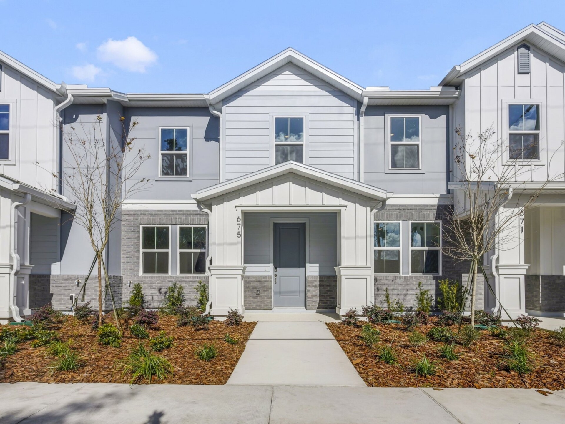front exterior of home with porch and gray front door