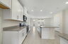 granite center island and stainless-steel appliances  