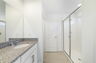dual sink vanity with mirror and shower