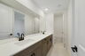 dual sink vanity with shower and water closet and dual entry