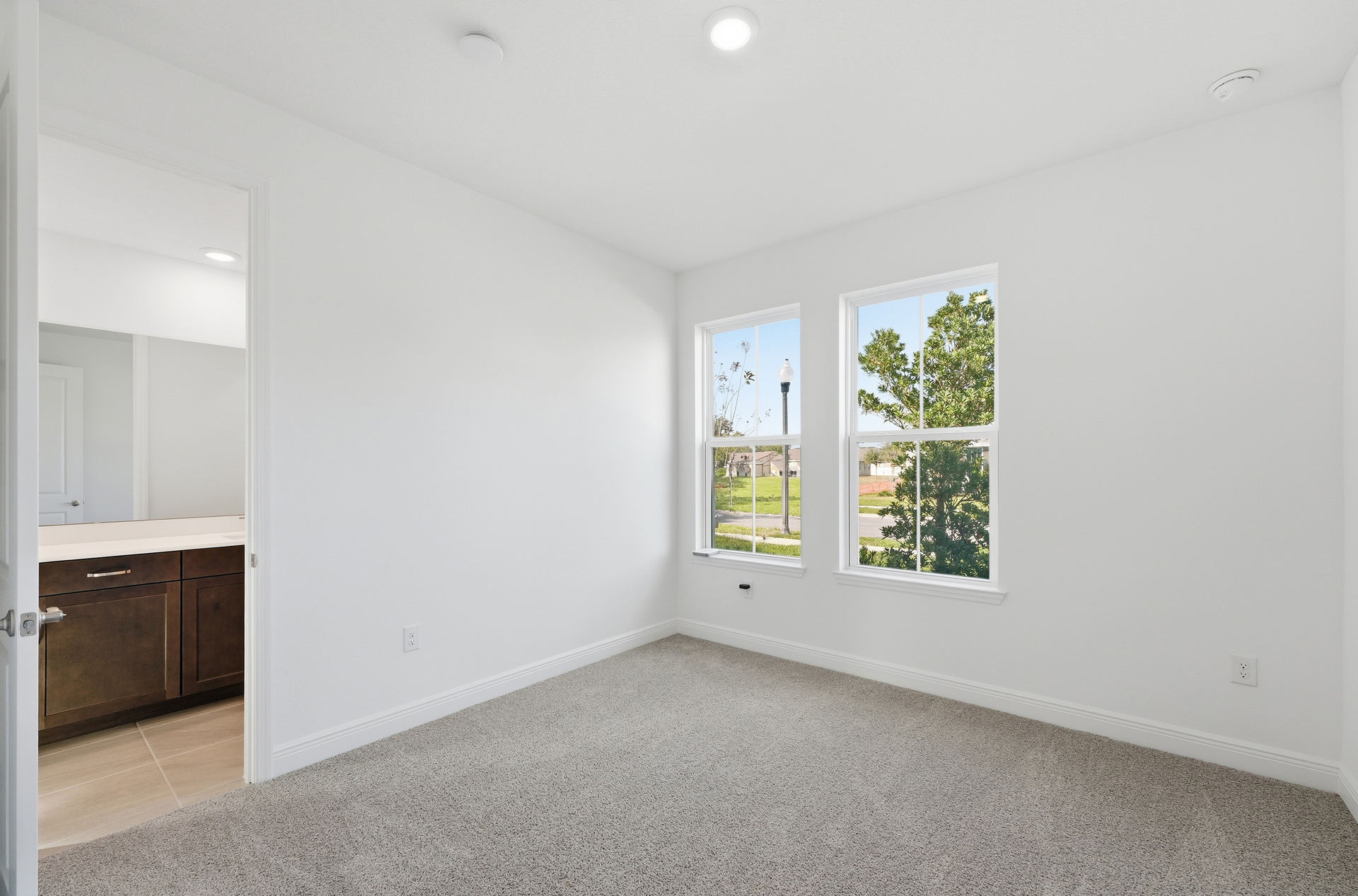 room with carpet throughout and windows 