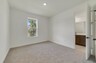 third bedroom with carpet and one window