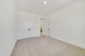 fourth bedroom with carpet and french door closet