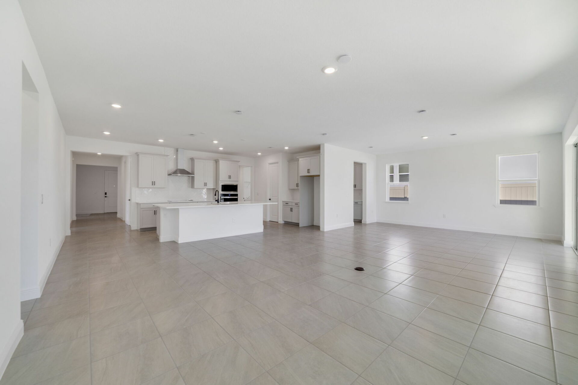 room with view of kitchen and sliding glass door to lanai