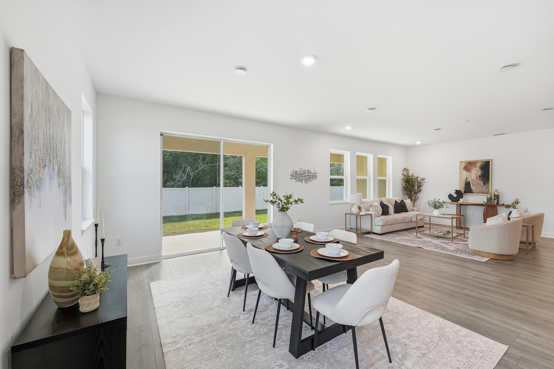 room with view of kitchen and sliding glass door to the lanai