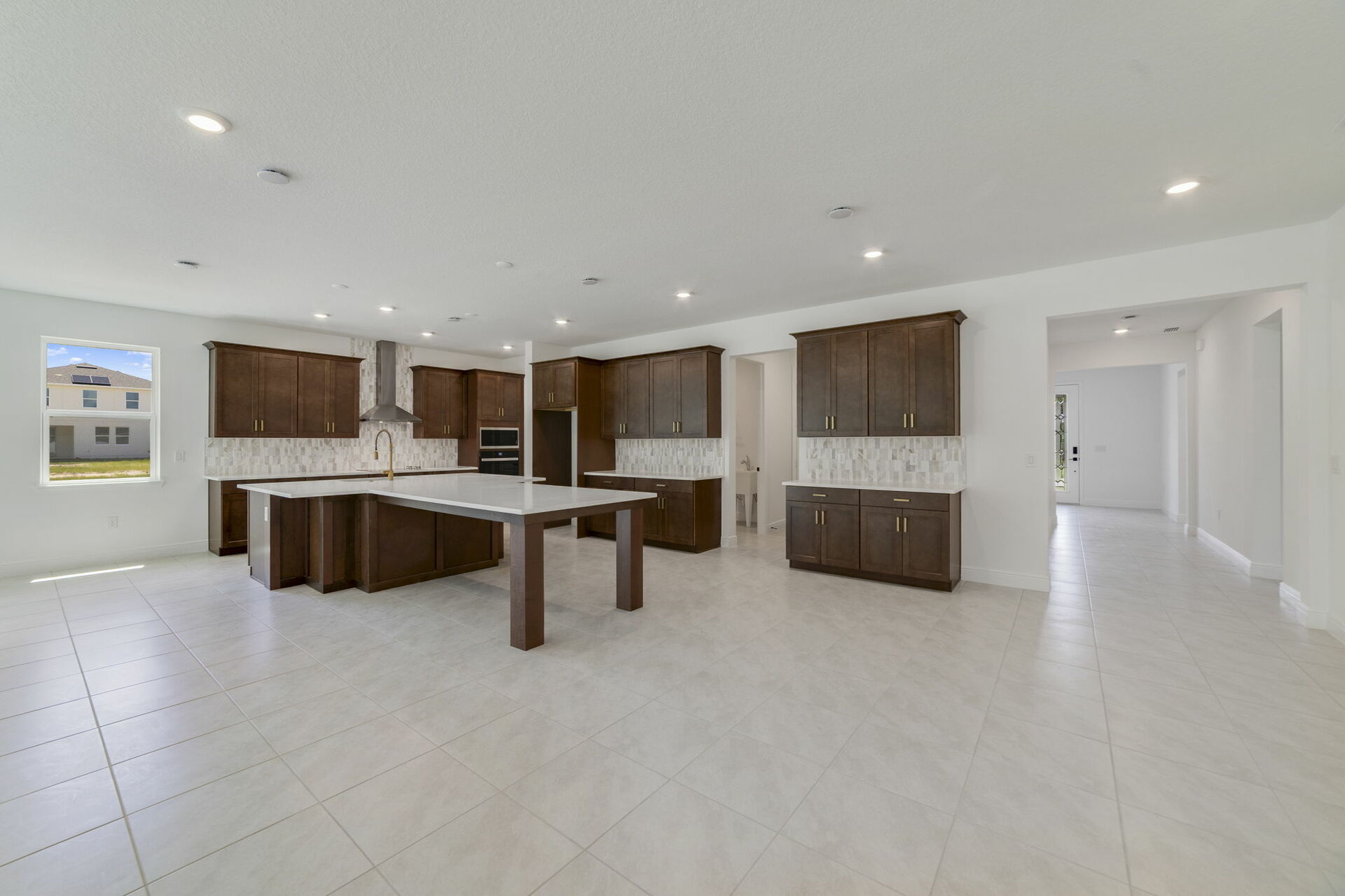 kitchen with brown cabinets and white quartz countertops