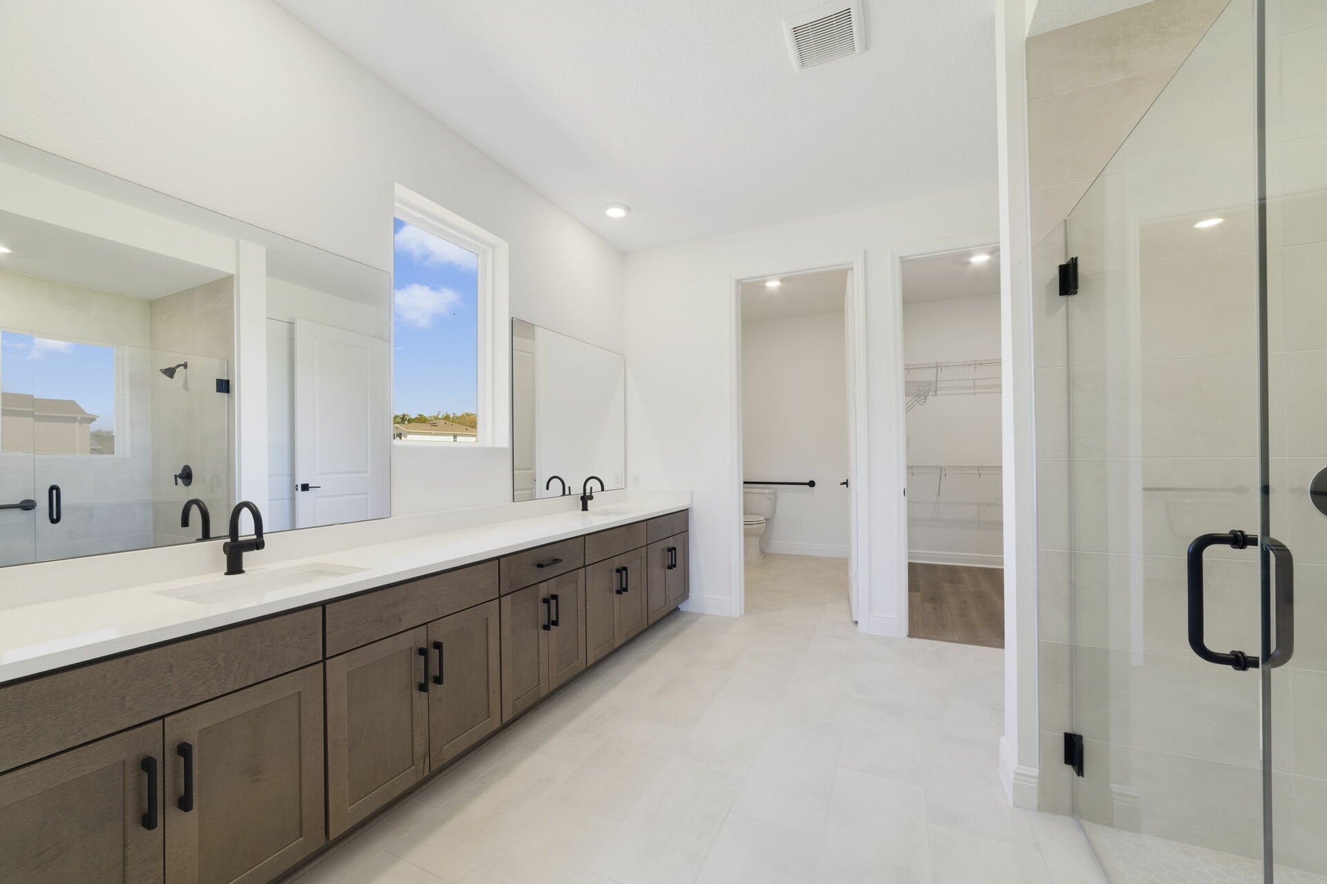 dual sink vanity with an oversized shower