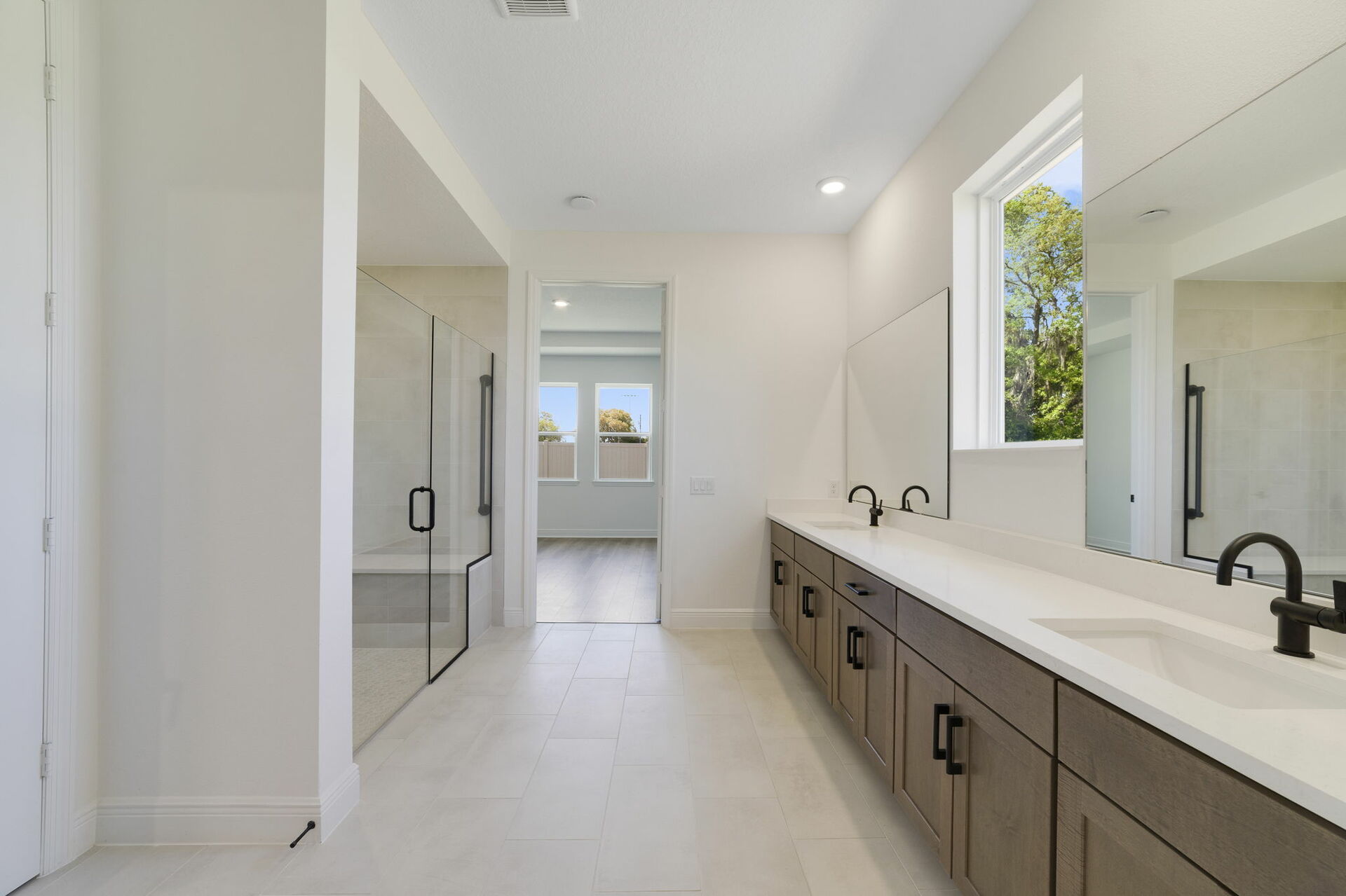 dual sink vanity with an oversized shower