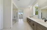 dual sink vanity with an oversized shower
