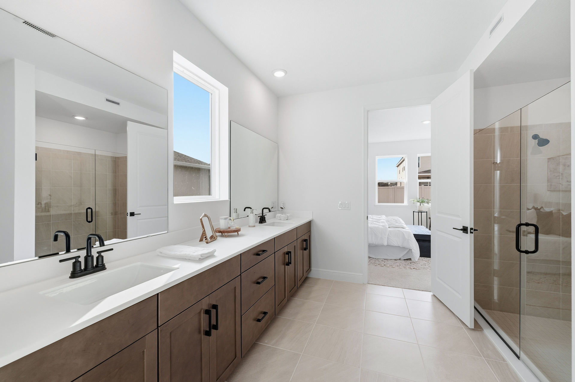 dual sink vanity with shower and primary closet