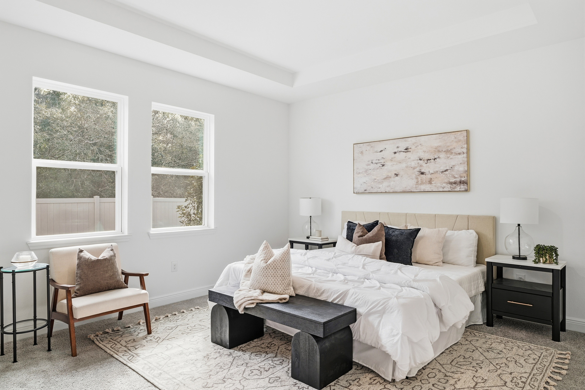 room with carpet throughout and tray ceilings