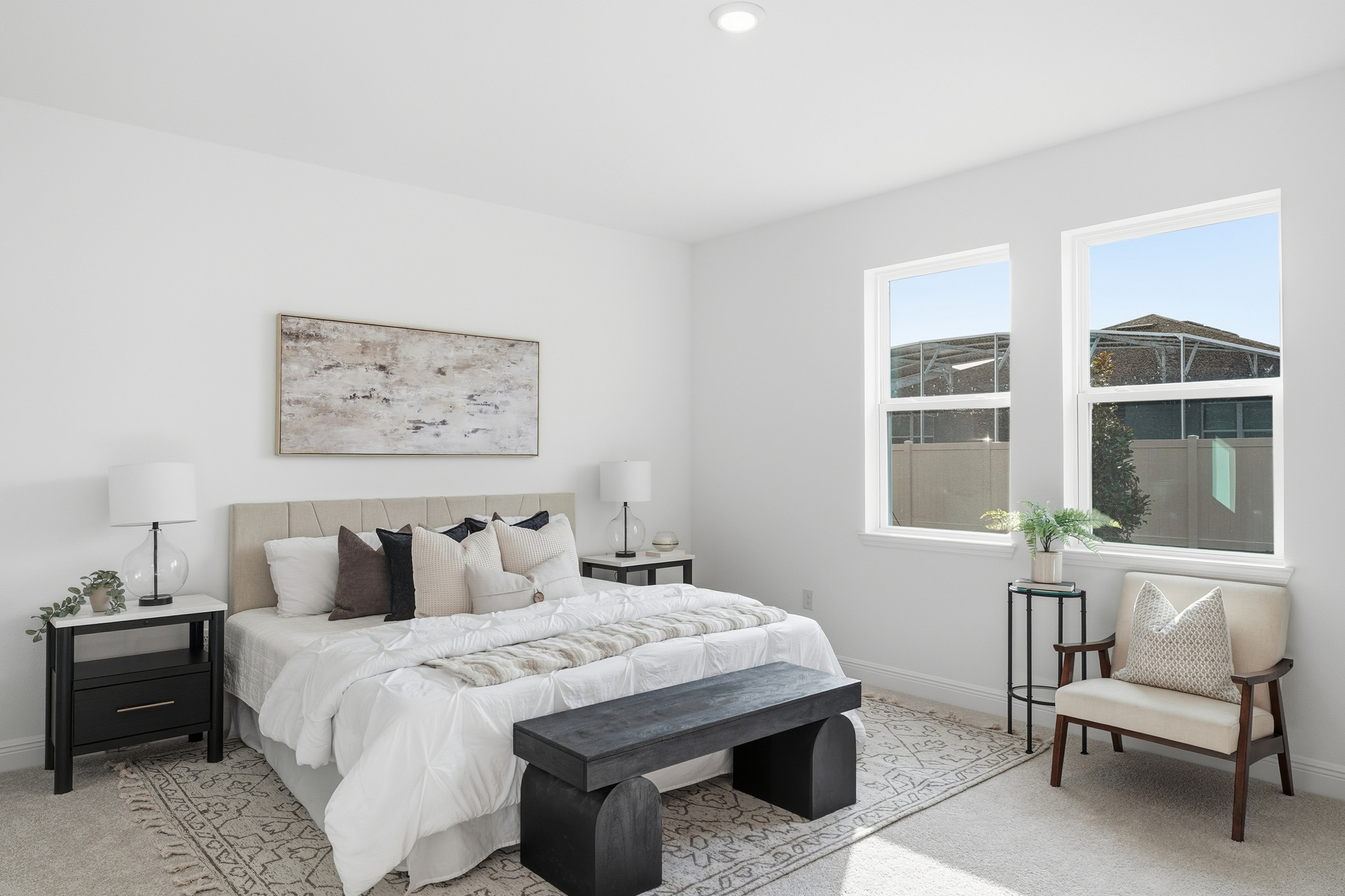 bedroom with large windows and carpet throughout