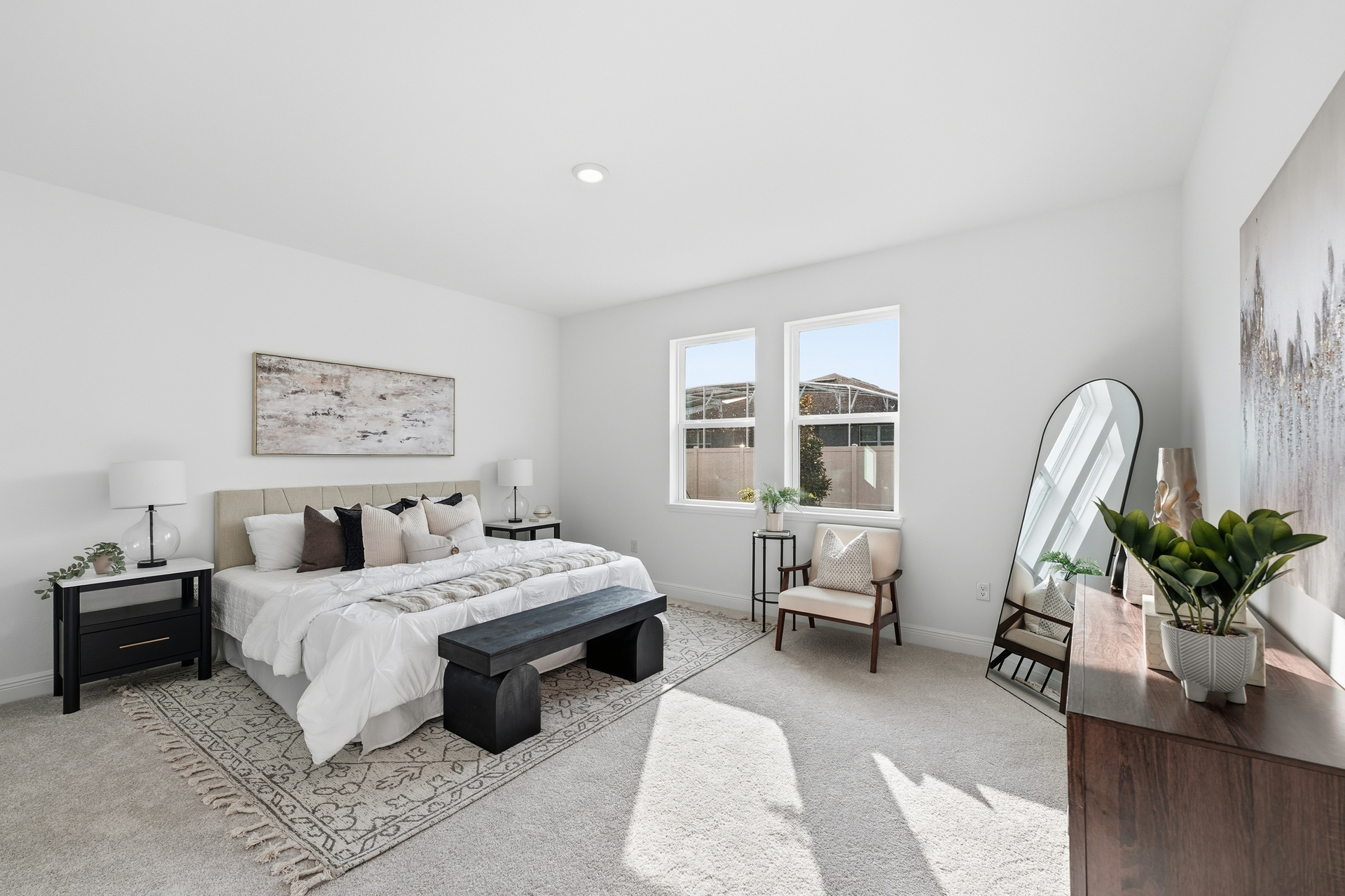 bedroom with large windows and carpet throughout