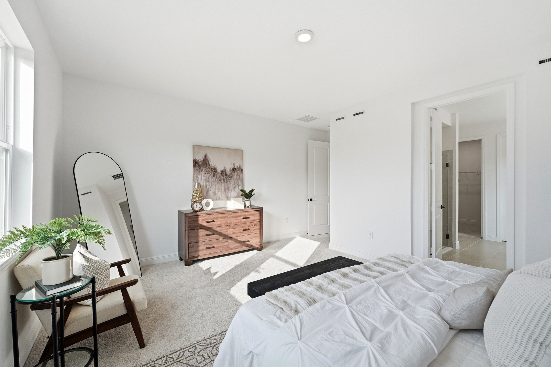 bedroom with large windows and carpet throughout