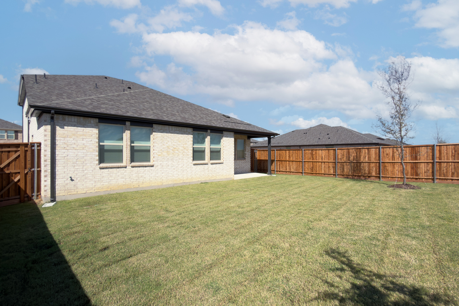 backyard of home with covered patio