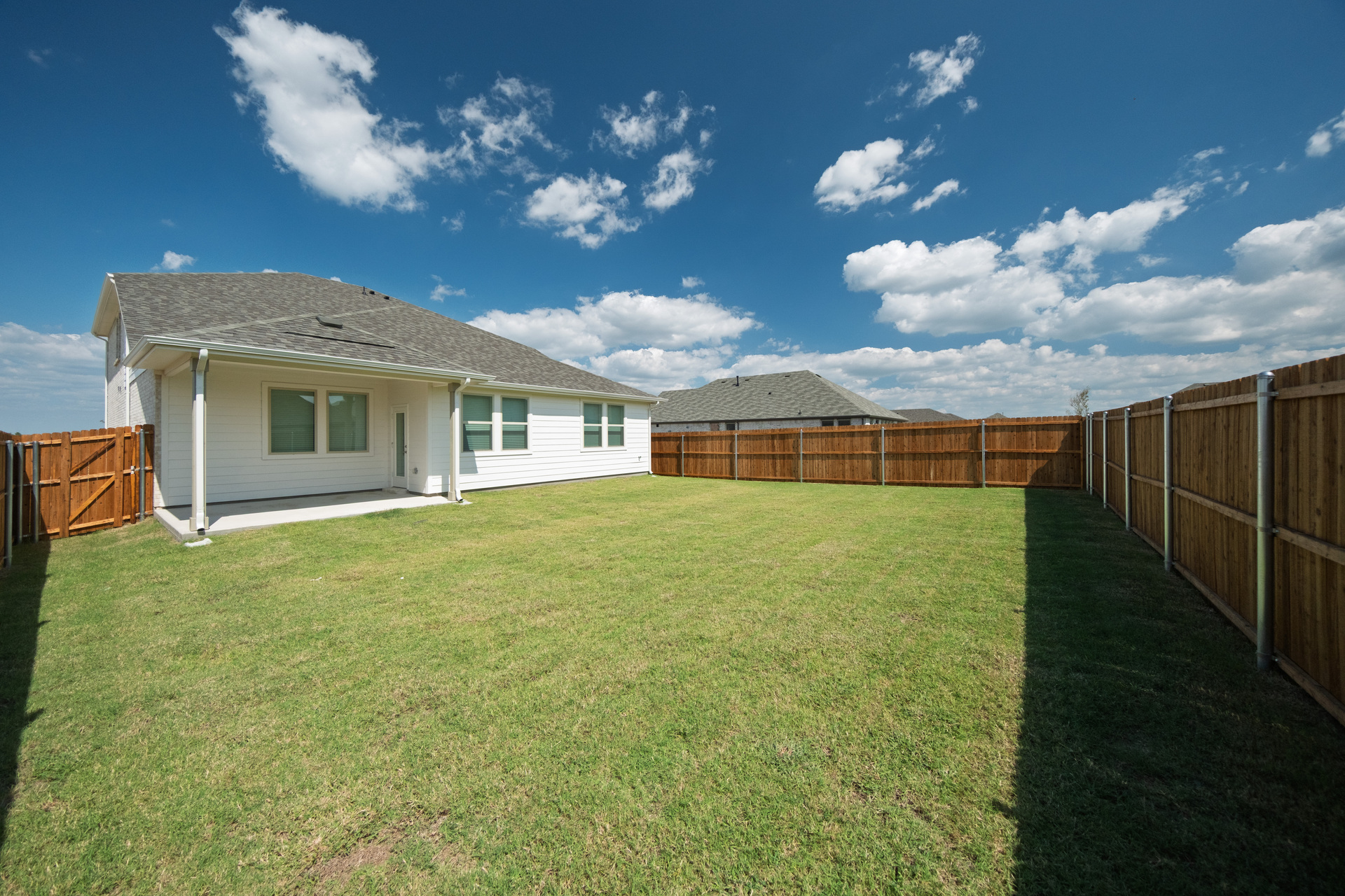 backyard of home with covered patio