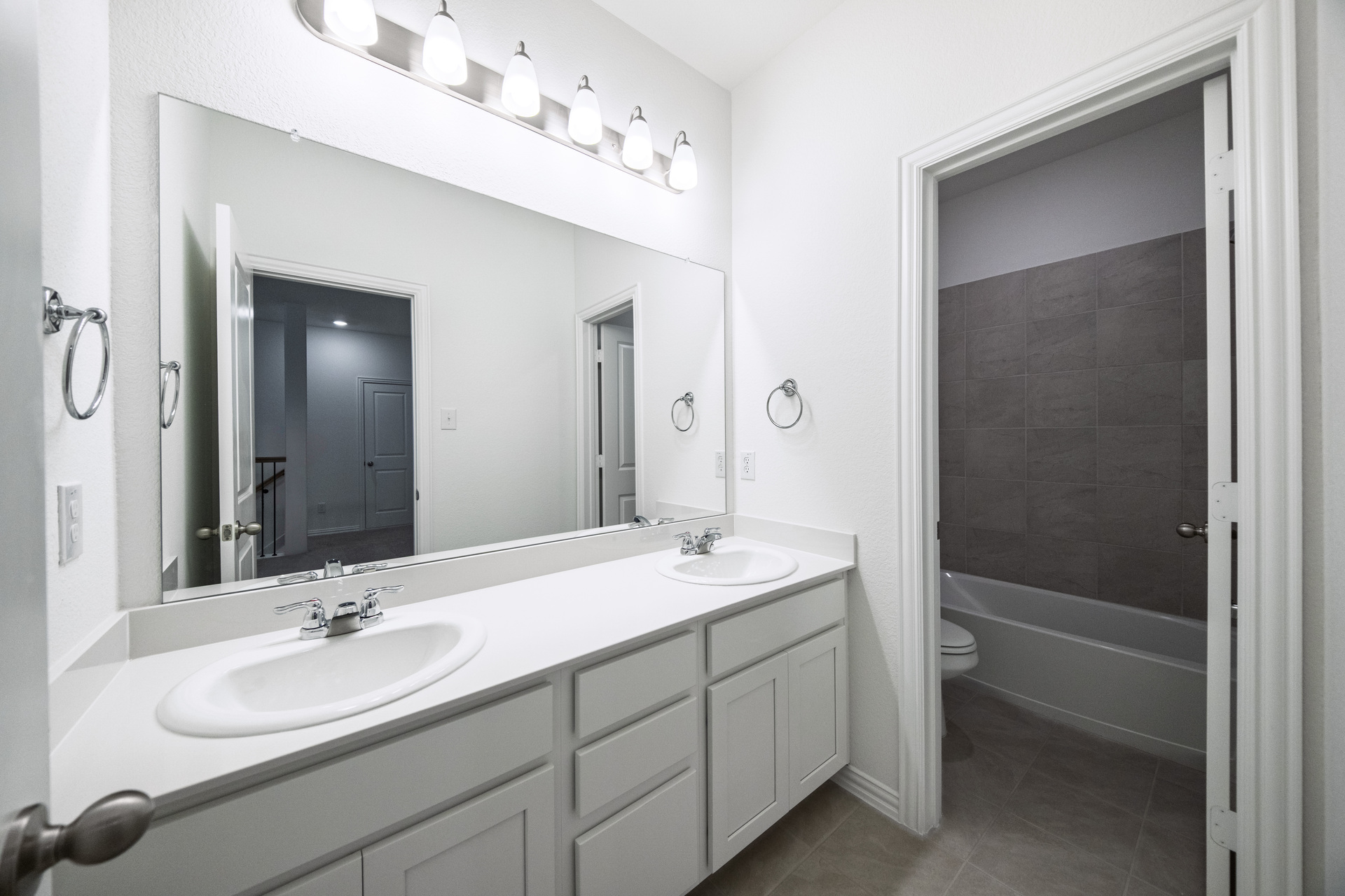 guest bathroom with double sinks