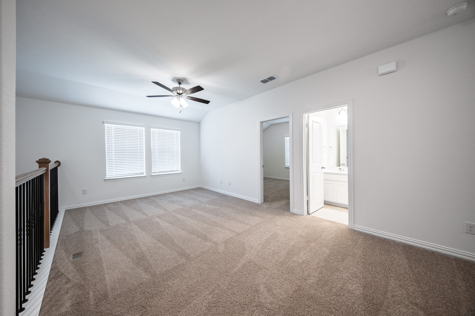open loft with carpet and window