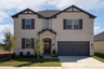 exterior of home with white brick and black siding