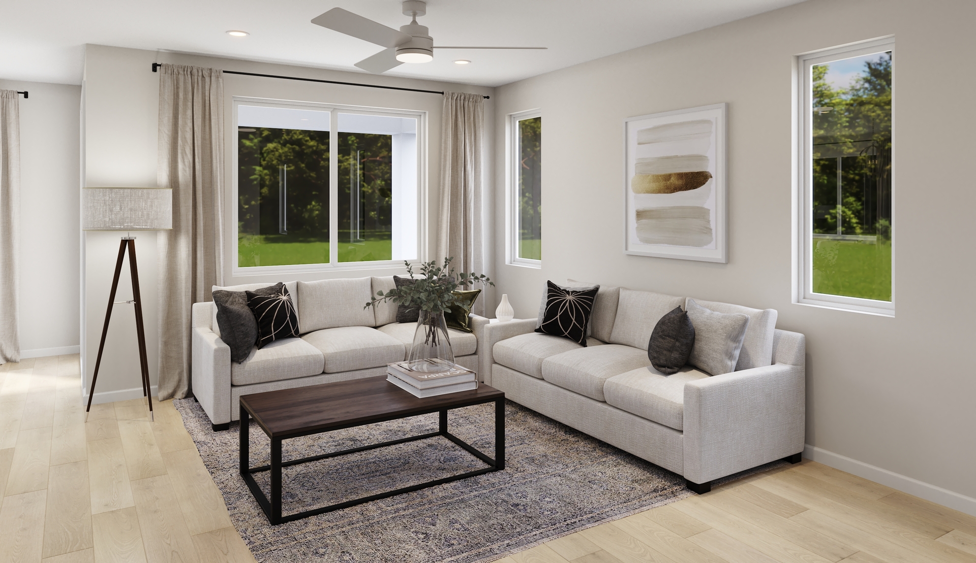 great room with neutral floors and large windows 